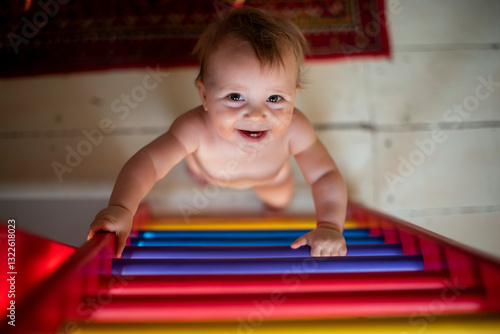 Baby Climbing a Colorful Ladder