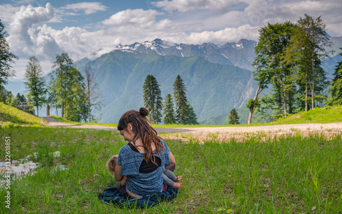 Mom Nursing Baby in Meadow photo