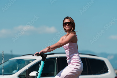 Elegant woman in a pink dress and sunglasses riding an electric scooter through the sunny city streets, embracing the freedom and style of a perfect urban adventure. photo