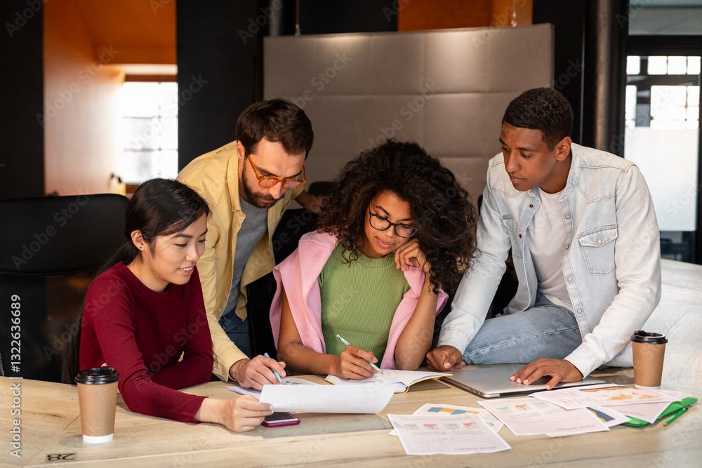 Group of four people solving problem in office Group of four people solving problem in office