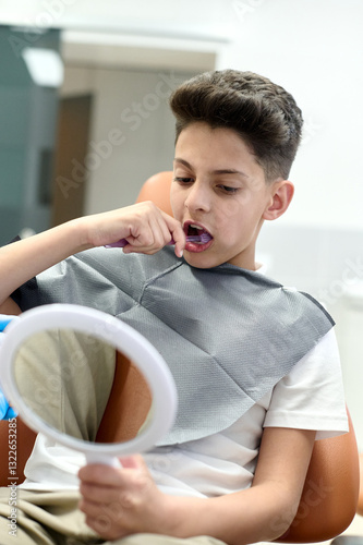 Kid learns to brush his teeth properly