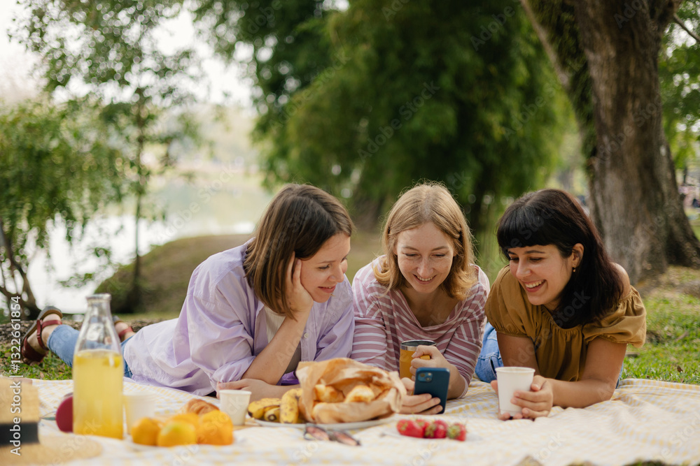Women friends browsing smartphone for pictures Women friends browsing smartphone for pictures