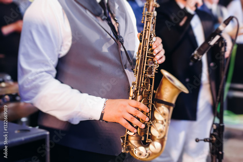 Photography Concert view of saxophonist musician, saxophone sax player with vocalist and mus