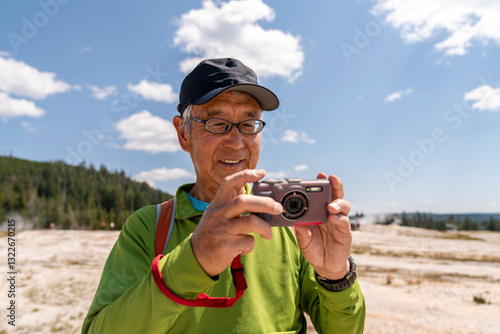 older tourist taking photo 