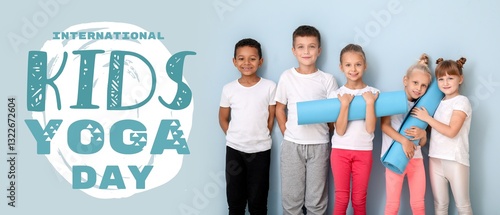 Little children with yoga m...