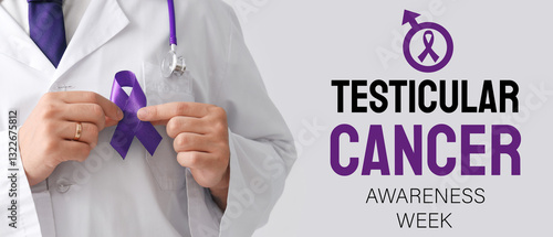 Foto Male doctor with blue ribbon on light background, closeup