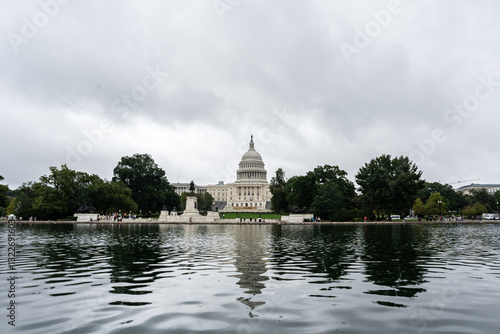 United States Capitol Building reflecting in the calm waters