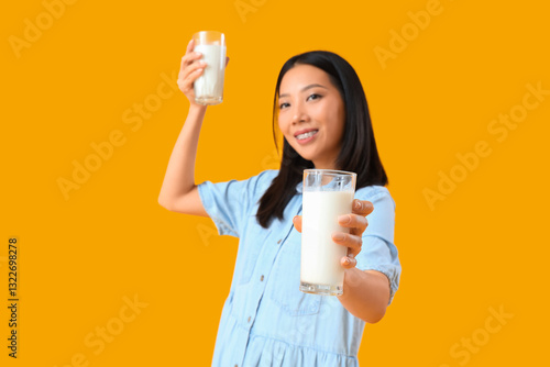 Young Asian woman with glas...