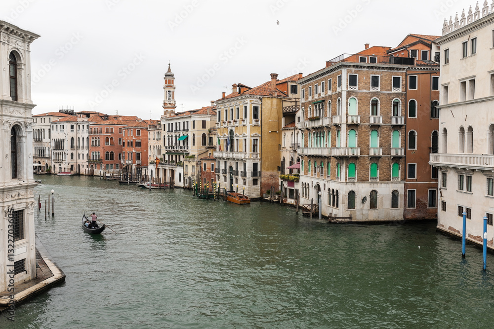 gondola with a gondolier rowing on the grand canal of venice in italy gondola with a gondolier rowing on the grand canal of venice in italy