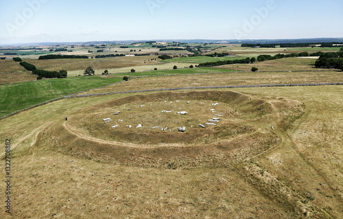 Obraz na płótnie Arbow Low Neolithic henge and stone circle and adjoined bowl barrow on limestone upland near Bakewell, Derbyshire. Parched summer drought conditions w salonie