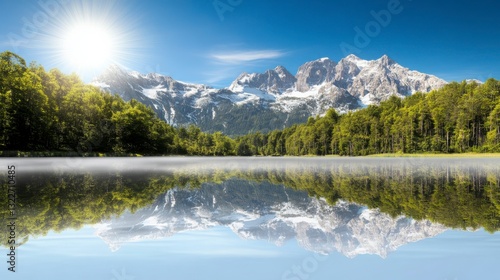 Serene Mountain Landscape with Reflection in Calm Water Under Sunlight