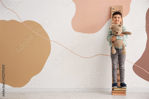 Cute little boy on books me...