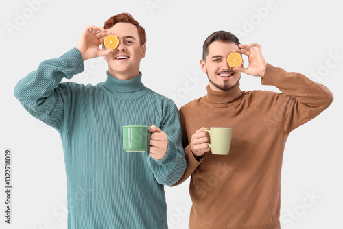 Young men with cups of tea ...