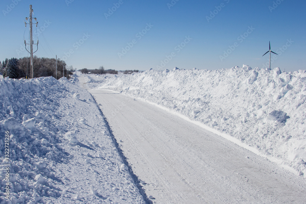deep snow drifts along a rural Minnesota road deep snow drifts along a rural Minnesota road