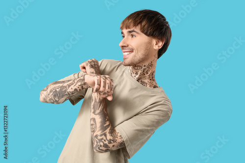 Young tattooed man dancing ...