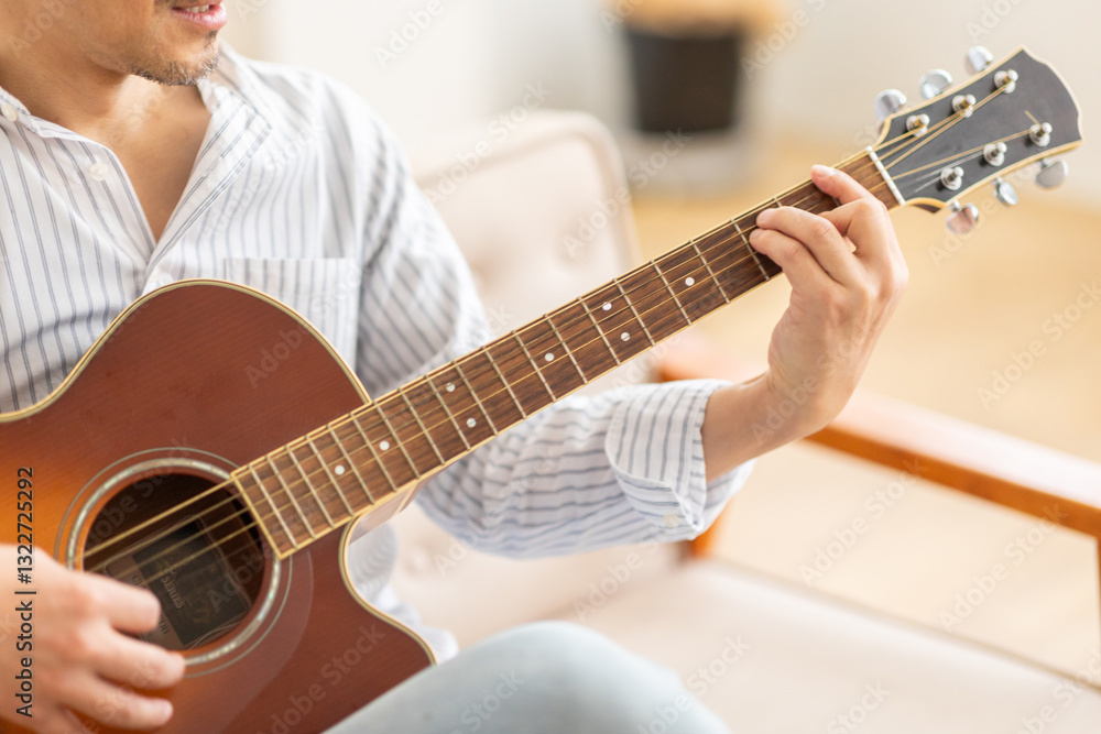 Fototapeta premium ギターを弾く男性