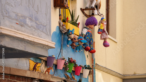 colorful decorations and plants and pots on the wall, balat, istanbul