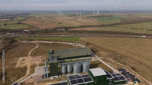 Wallpaper Mural Aerial view of agricultural corn grain processing facility wind farm turbines in background in England UK Europe on a sunny day.  Torontodigital.ca