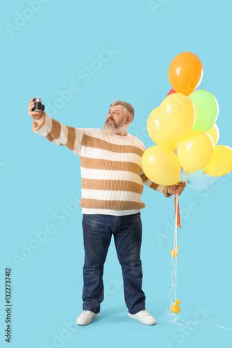 Senior man with bunch of ba...