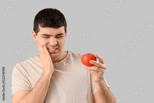 Young man with tomato suffe...