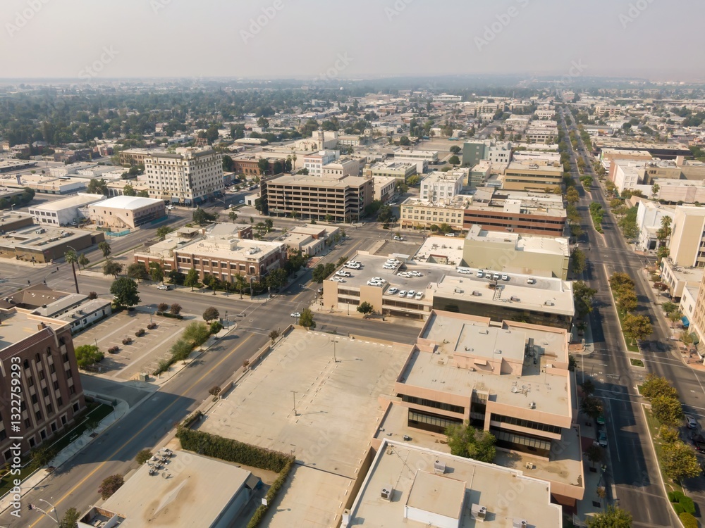 Fototapeta premium Aerial view of Bakersfield, California, USA, showing the city's urban landscape and street grid. The photo captures the city's layout and architectural styles.