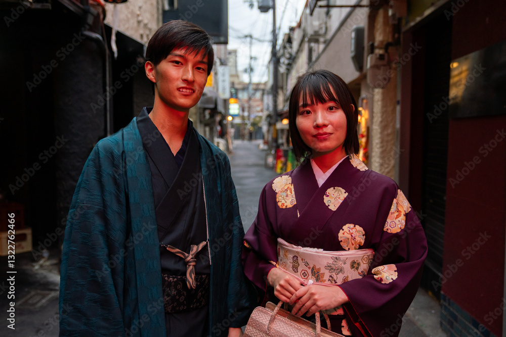 Japanese couple looking at camera on the street in Kyoto Japanese couple looking at camera on the street in Kyoto
