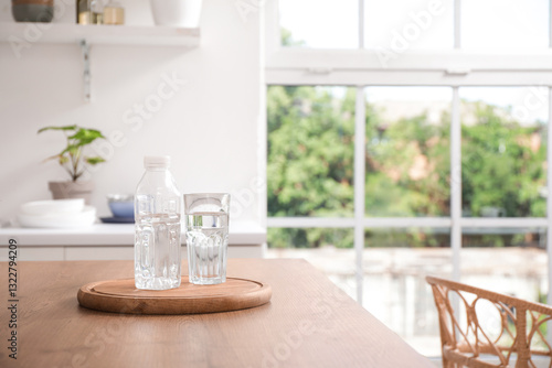 Bottle of water with glass ...