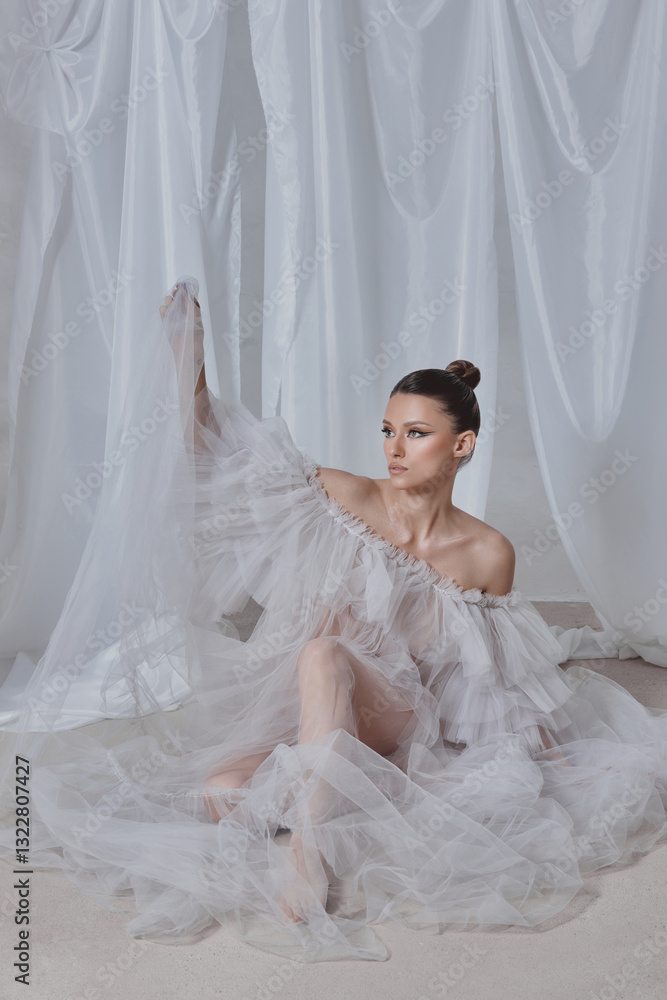 model with an elegant hairstyle sits gracefully, wearing a flowing sheer dress. soft, draped backdrop creates a serene atmosphere, emphasizing the delicate fabric and her poised expression model with an elegant hairstyle sits gracefully, wearing a flowing sheer dress. soft, draped backdrop creates a serene atmosphere, emphasizing the delicate fabric and her poised expression