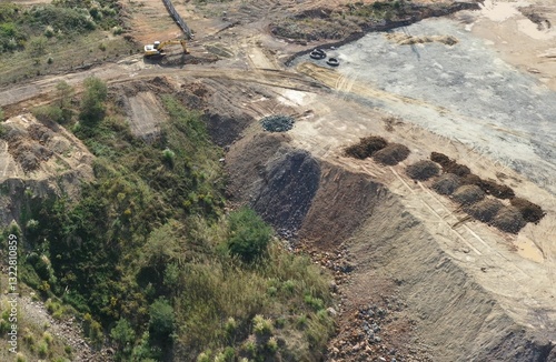 trucks dumping excavation on vacant land