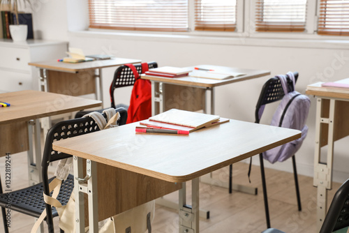 School desk with notebooks ...