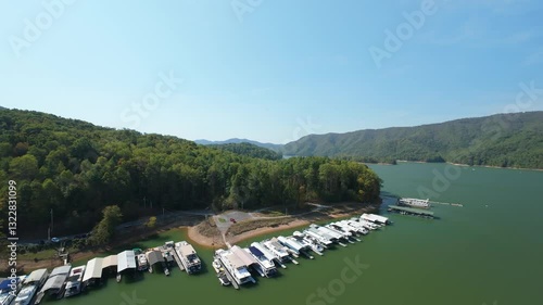 Wallpaper Mural Aerial Drone View of Watauga Lake Marina, Tennessee, USA beautiful aerial view Watauga Lake Tennessee marina with boats docked along shoreline, surrounded by lush green mountains clear blue skies. Torontodigital.ca