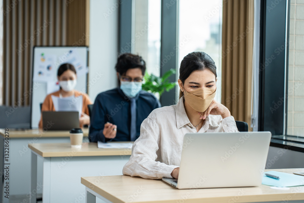 Asian attractive business people wear face mask and working in office. Asian attractive business people wear face mask and working in office.
