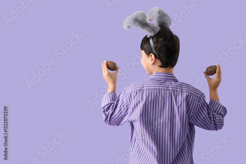Cute boy in bunny ears with...