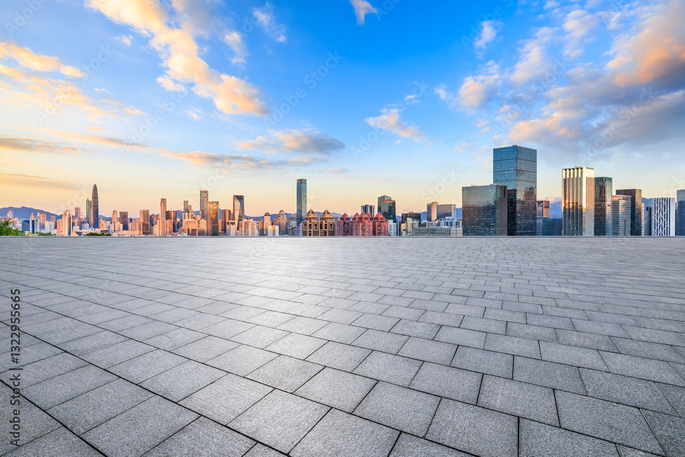 Empty square floor and city skyline with modern buildings at sunset in Shenzhen