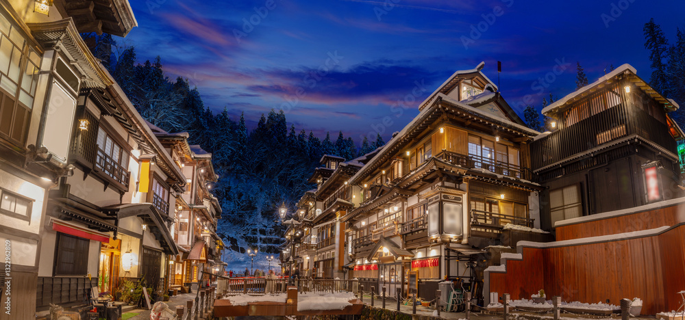 Fototapeta premium snowy winter evening in Ginzan Onsen, which is a famous hot spring town in Obanazawa, Yamagata, Japan