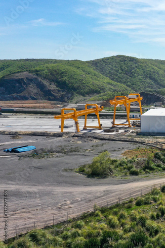 two yellow gigantic gantry cranes photo