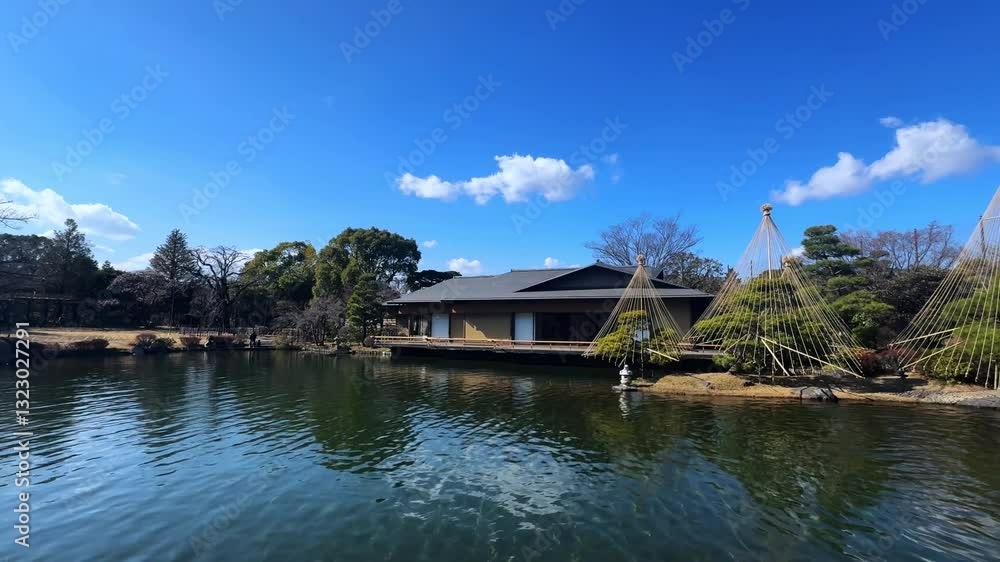 Serene Japanese garden with traditional architecture, trees, and pond Serene Japanese garden with traditional architecture, trees, and pond