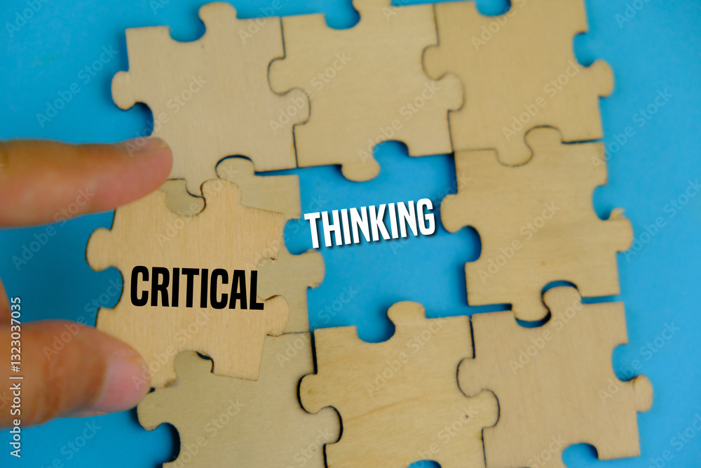Critical Thinking concept on wooden block over blue background. Critical Thinking concept on wooden block over blue background.