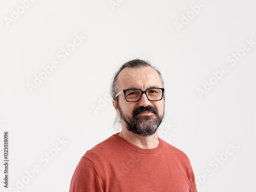 Portrait of Bearded Man In His 50s Wearing Glasses and a Red Sweater 