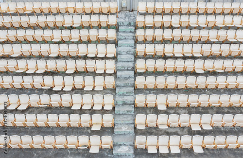 Outdoor Amphitheater Rows of White Folding Chairs photo