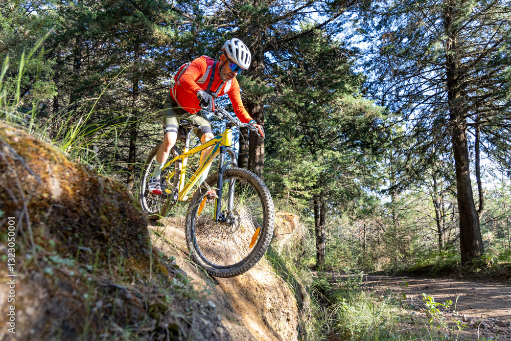 Professional cyclist riding down a steep hillside Professional cyclist riding down a steep hillside