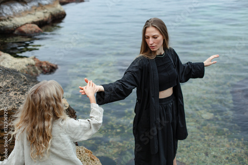 mother and daughter by the sea