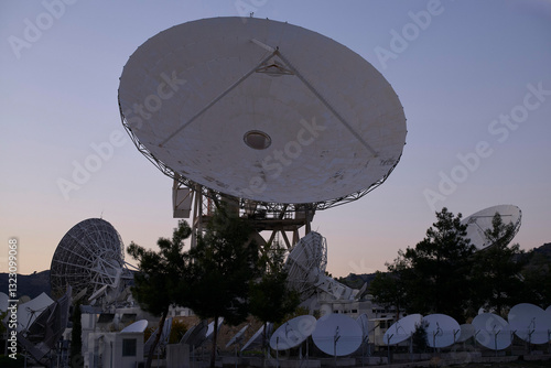 Satellite dishes in Cyprus earth link statio during offseason twilight photo