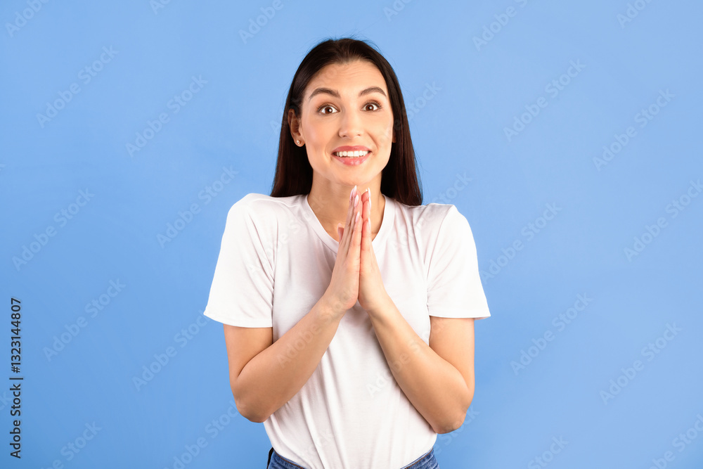 Desire Concept. Portrait of funny lady keeping palms together, asking to buy her something or to do her a favour. Hopeful young woman making request, pleading for mercy, begging, blue studio wall Desire Concept. Portrait of funny lady keeping palms together, asking to buy her something or to do her a favour. Hopeful young woman making request, pleading for mercy, begging, blue studio wall