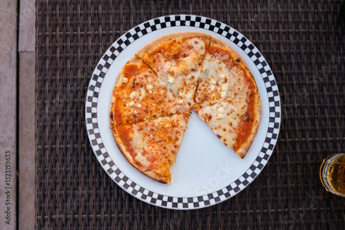 Four cheese pizza on a plate. photo