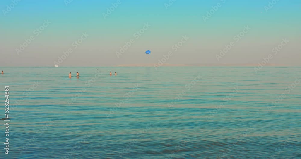 Idyllic Scene Of People Swimming On The Red Sea During Daytime In Hurghada, Egypt. Static, Panning Shot Idyllic Scene Of People Swimming On The Red Sea During Daytime In Hurghada, Egypt. Static, Panning Shot