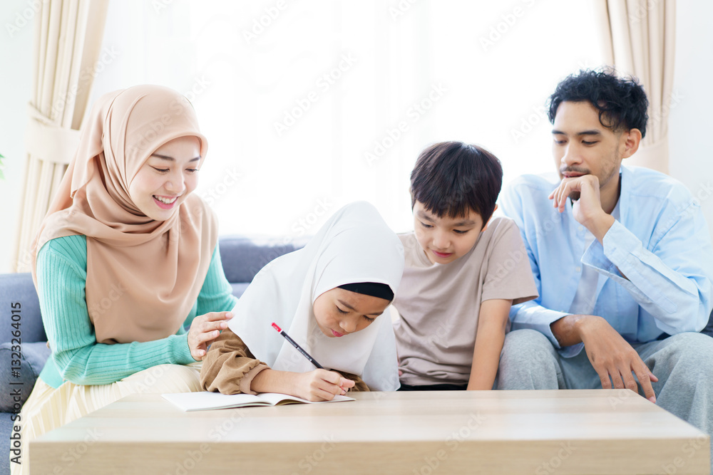 Asian muslim family relaxing in living room together. Asian muslim family relaxing in living room together.