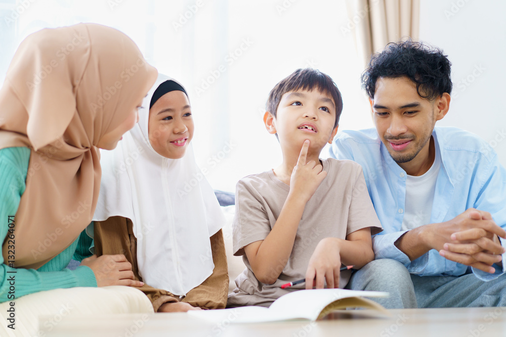 Asian muslim family relaxing in living room together. Asian muslim family relaxing in living room together.