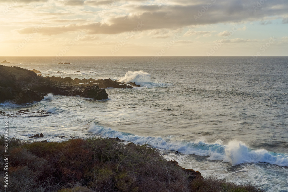 Waves crashing on volcanic shore Waves crashing on volcanic shore