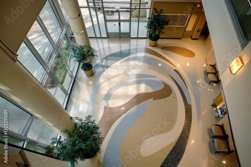 Overhead view of modern hospital corridor with artistic flooring and seating arrangement